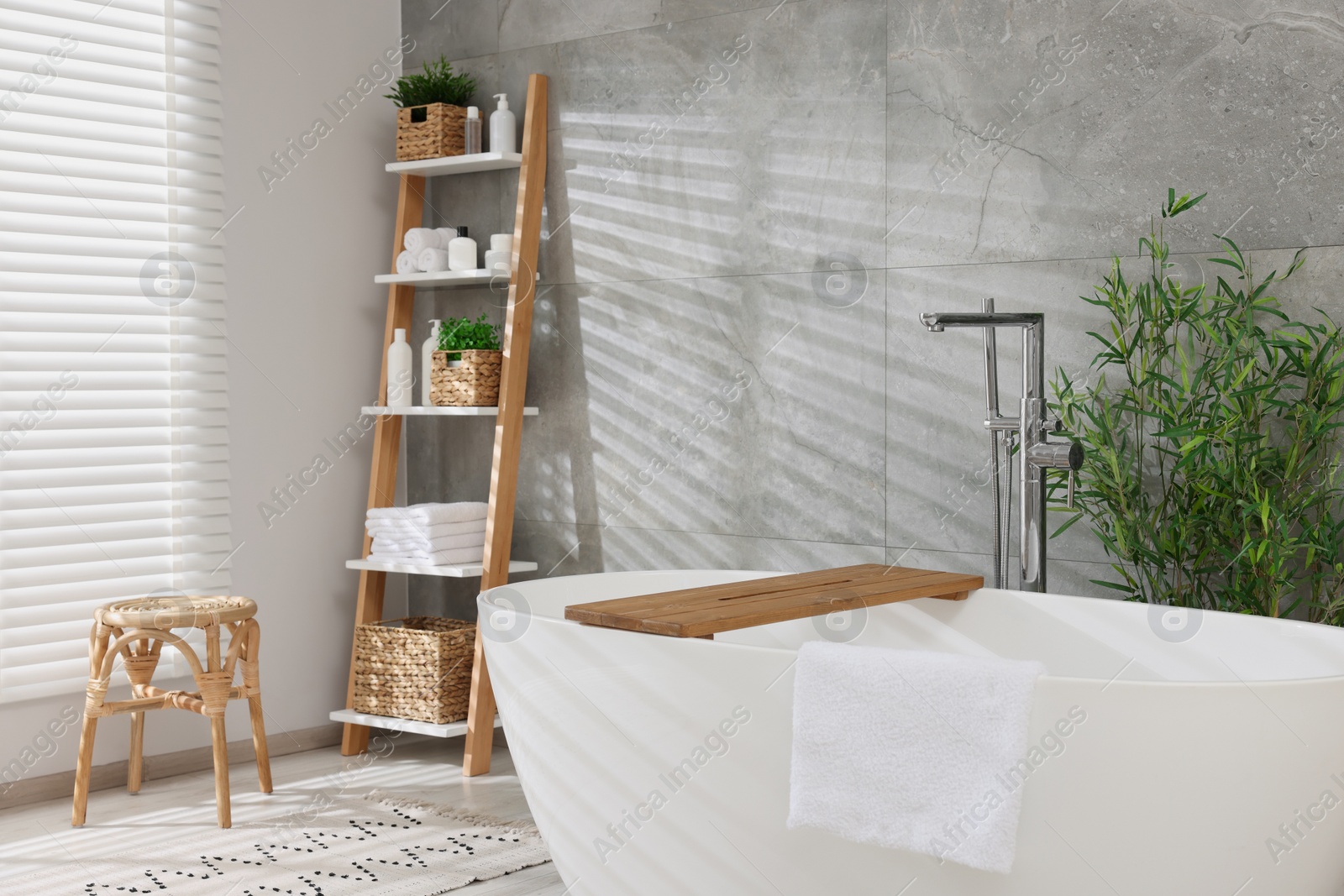 Photo of Different potted artificial plants in bathroom. Home decor