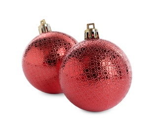 Beautiful shiny red Christmas balls on white background