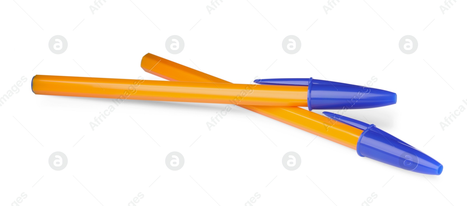 Photo of New orange plastic pens isolated on white