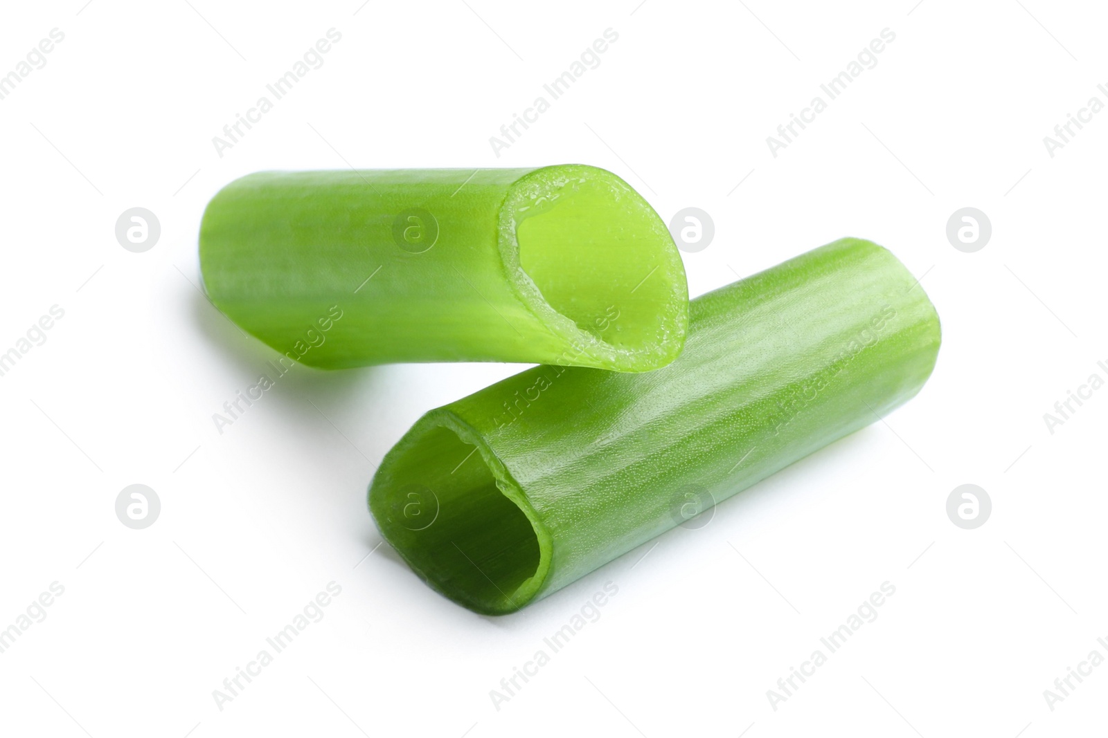 Photo of Pieces of fresh green onion on white background