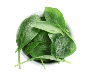 Photo of Fresh green healthy baby spinach leaves in ceramic bowl isolated on white, top view