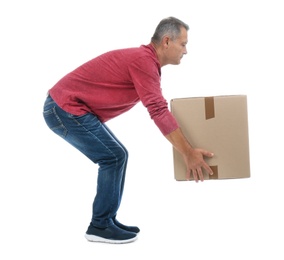 Photo of Full length portrait of mature man lifting carton box on white background. Posture concept