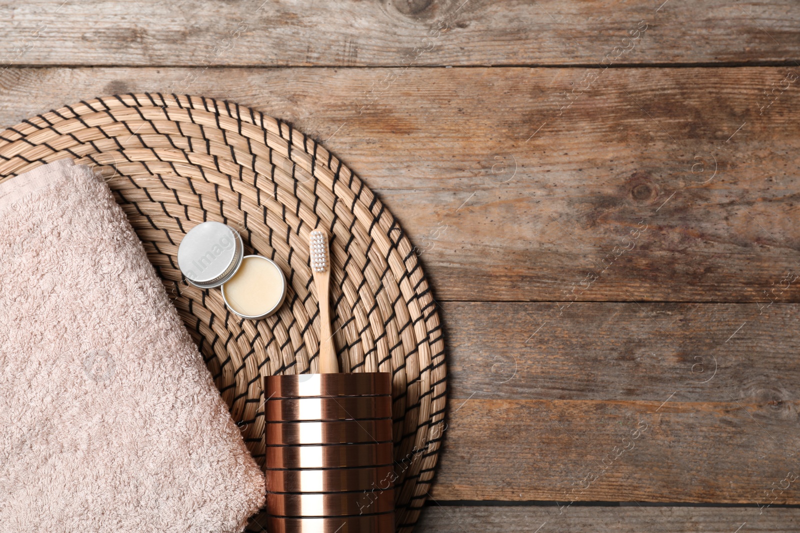 Photo of Flat lay composition with bamboo toothbrush and space for text on wooden background