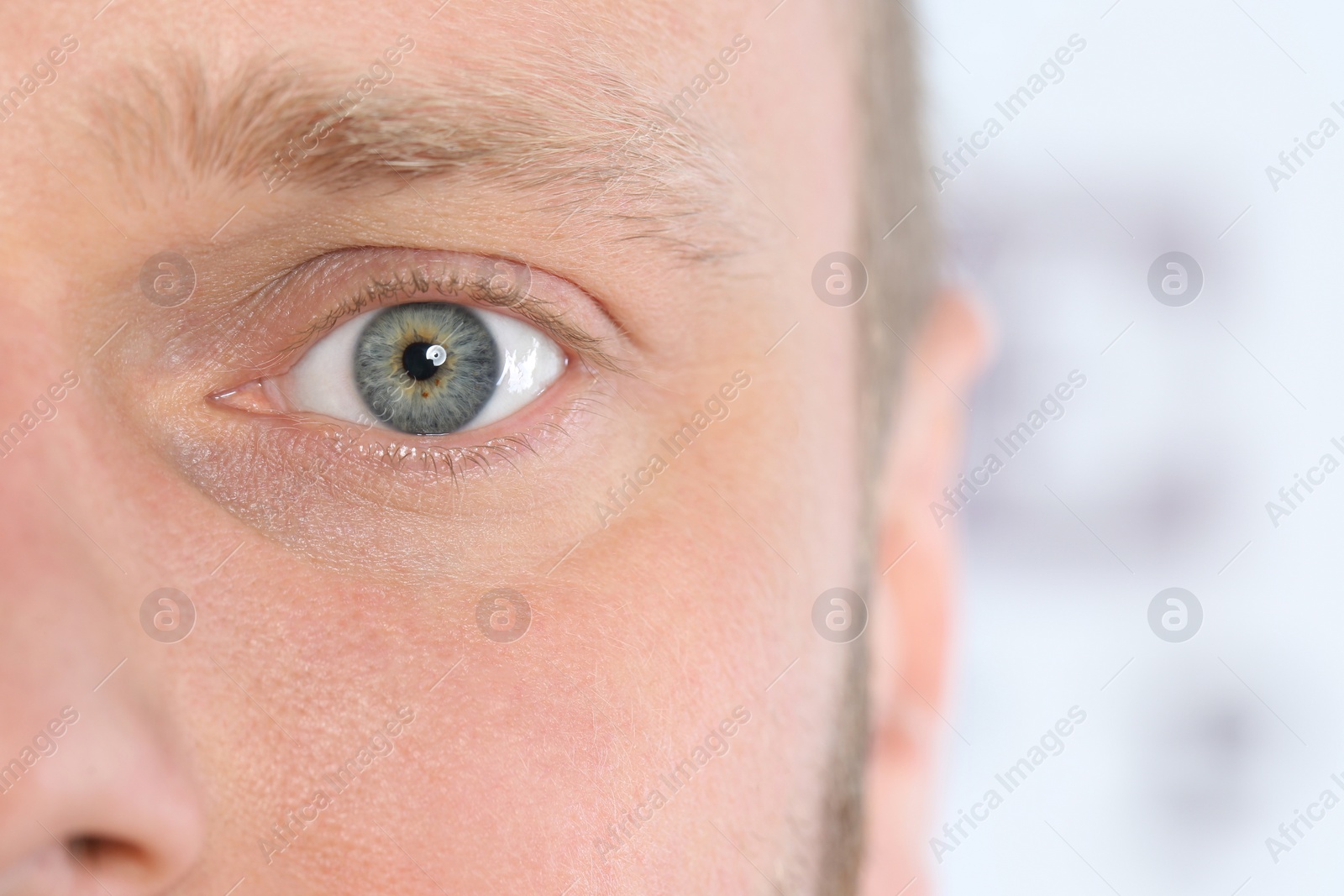 Photo of Young handsome man, focus on eye. Vision examination