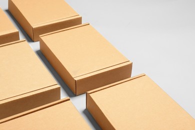 Many cardboard boxes on white background, space for text. Packaging goods