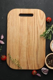 Photo of Cutting board, fresh tomatoes and different spices on grey textured table, flat lay