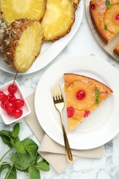 Delicious cut pineapple pie with cherry and mint on white marble table, flat lay