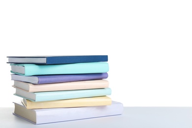 Photo of Stack of books on white background. Space for text