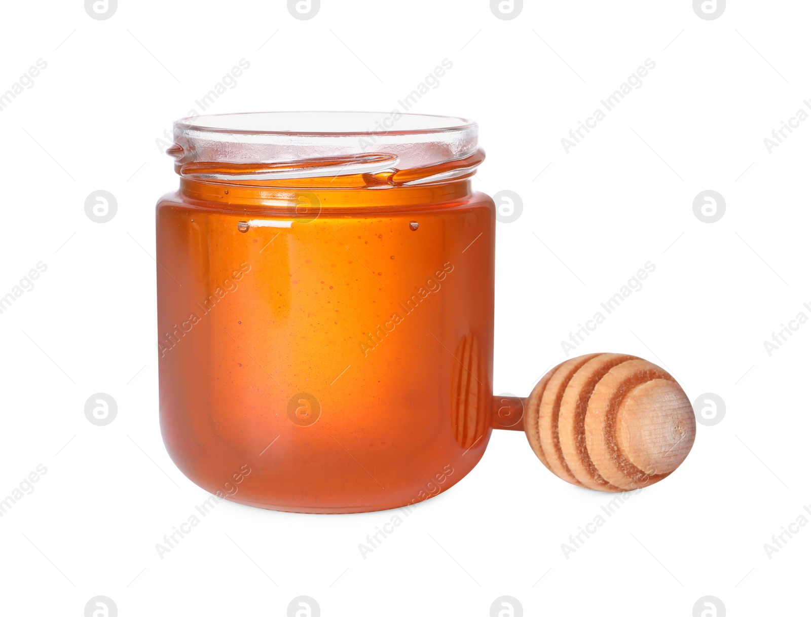 Photo of Tasty natural honey in glass jar and dipper isolated on white