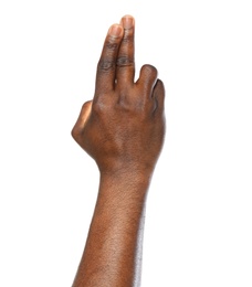 African-American man making promise on white background, closeup