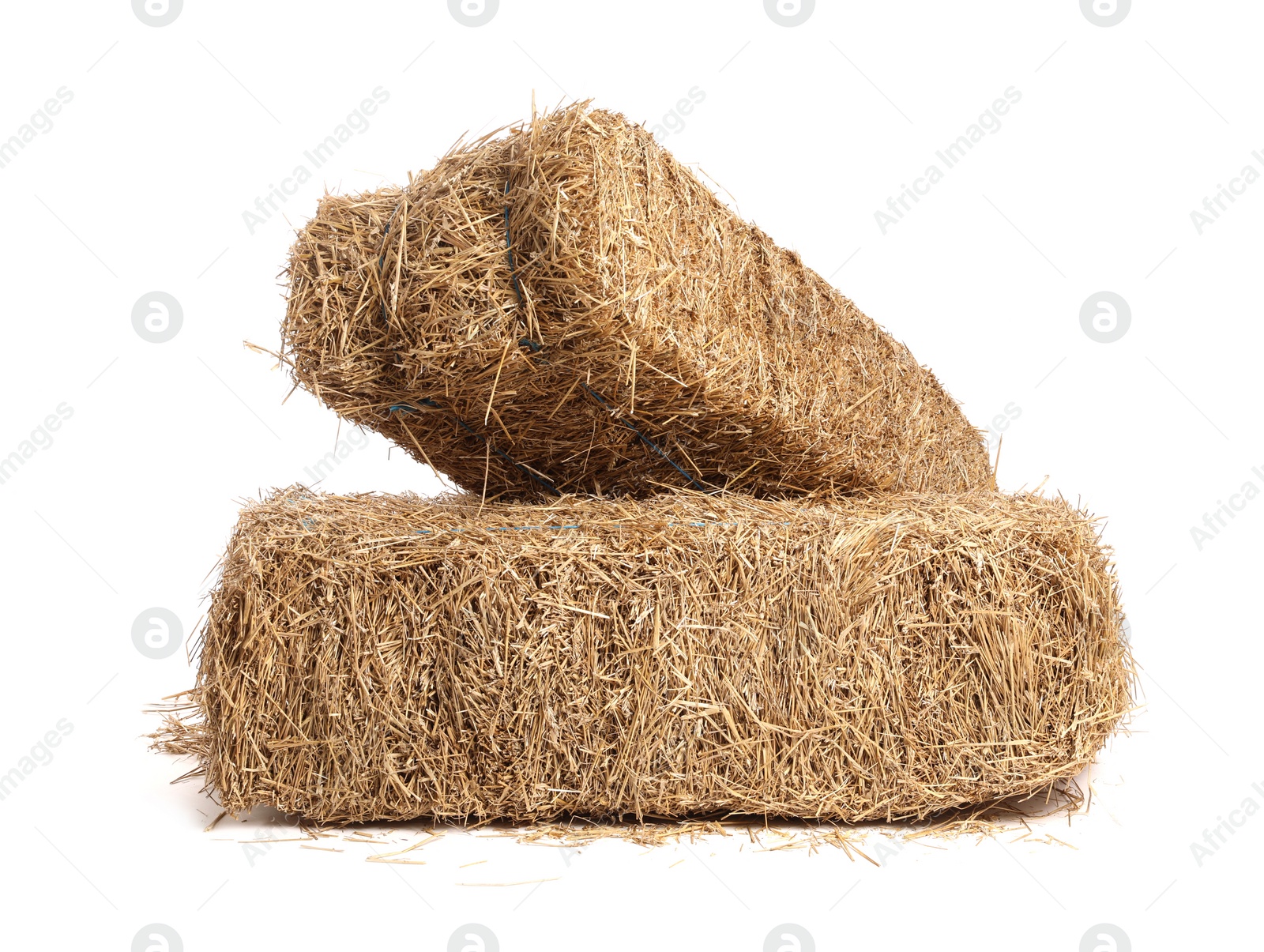 Photo of Bales of dried straw isolated on white