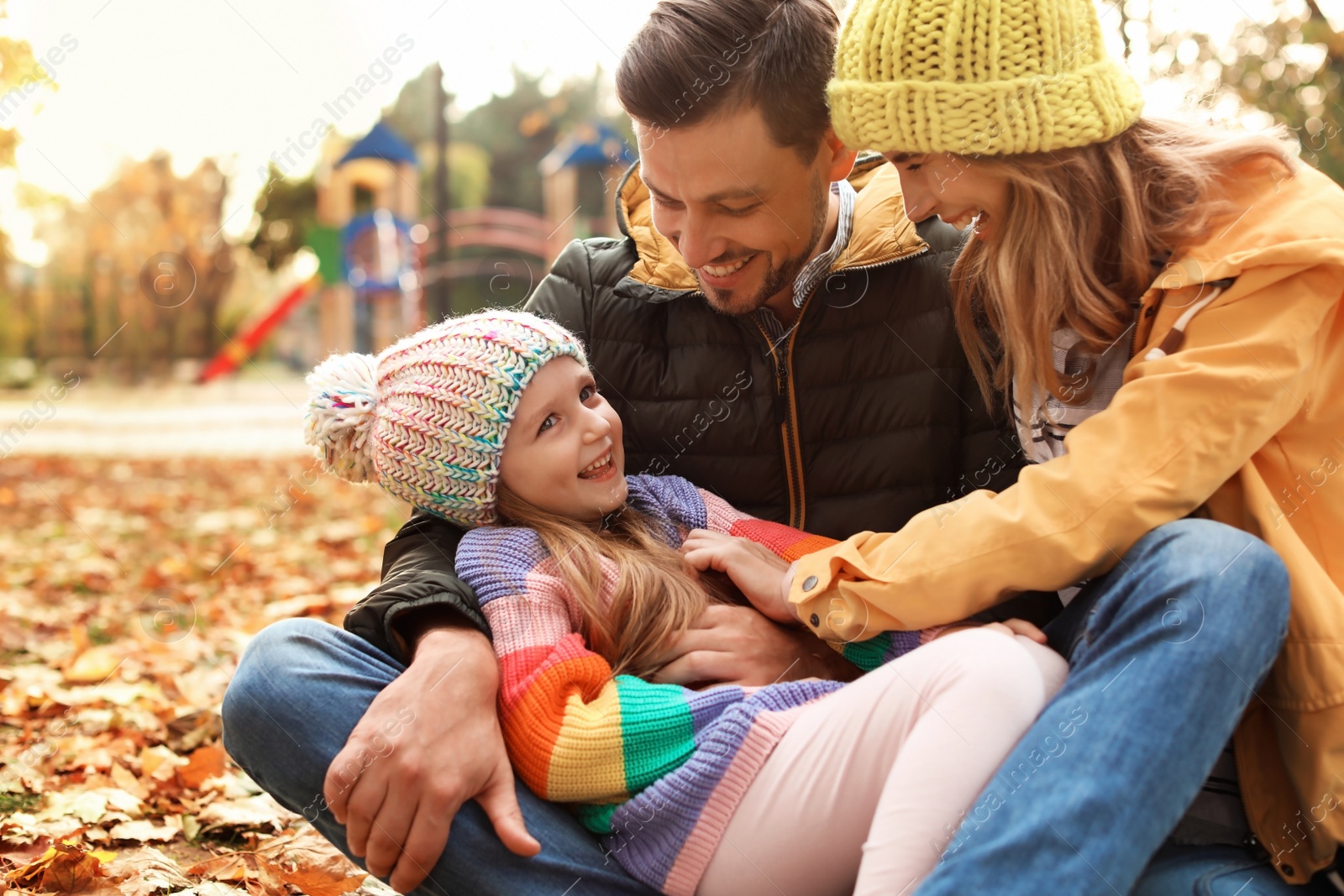 Photo of Happy family with child together in park. Autumn walk