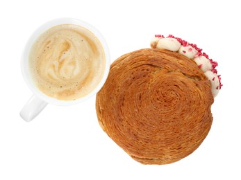 Photo of Round croissant with cream and cup of coffee isolated on white, top view. Tasty puff pastry