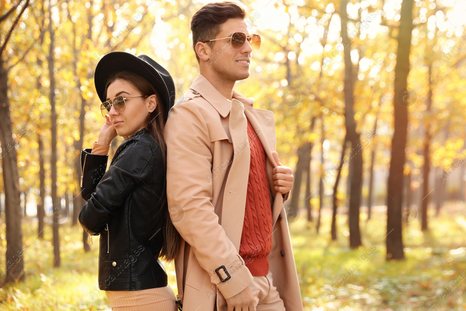 Photo of Lovely couple walking in park on autumn day