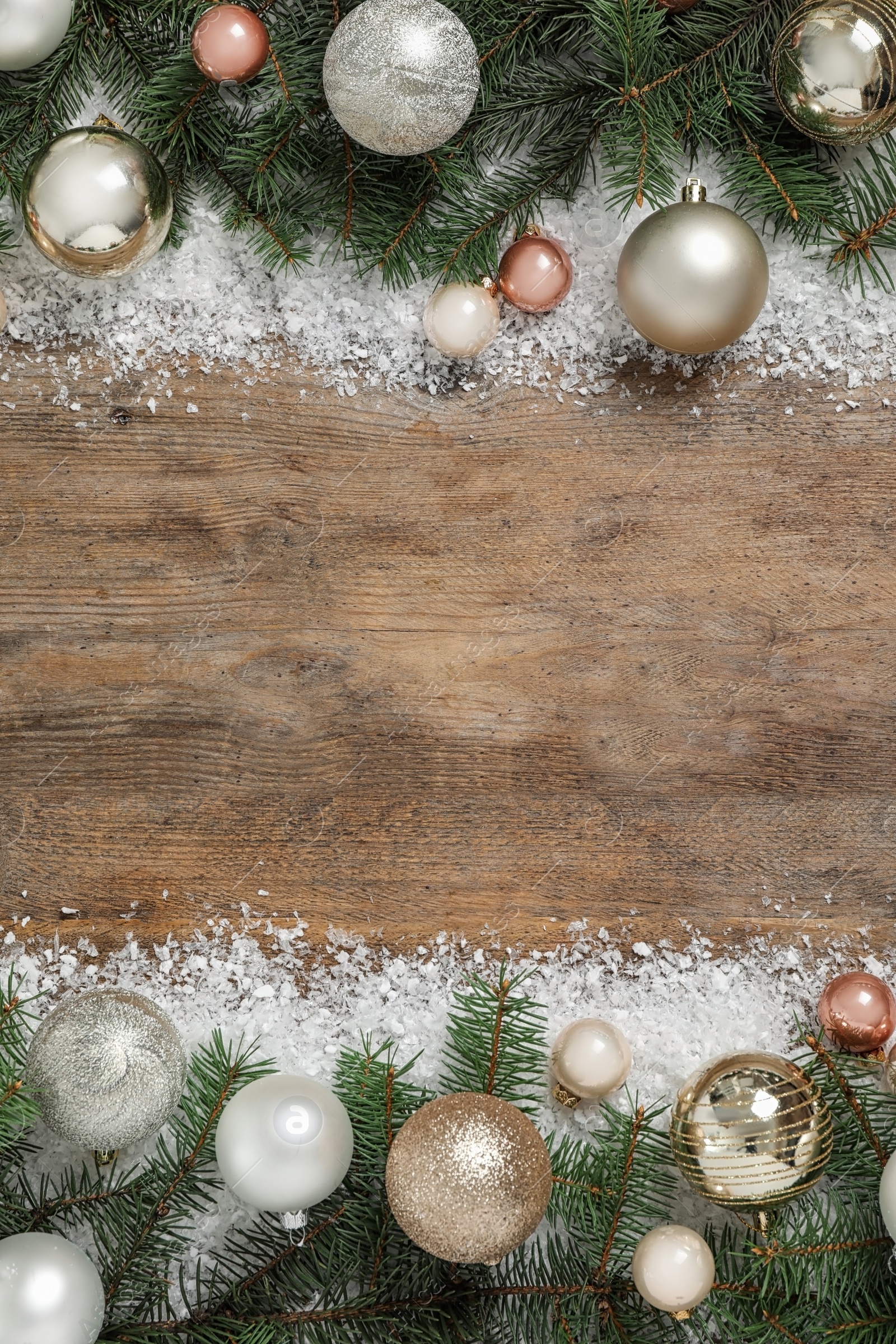 Photo of Fir branches, Christmas decoration and snow on wooden background, flat lay. Space for text