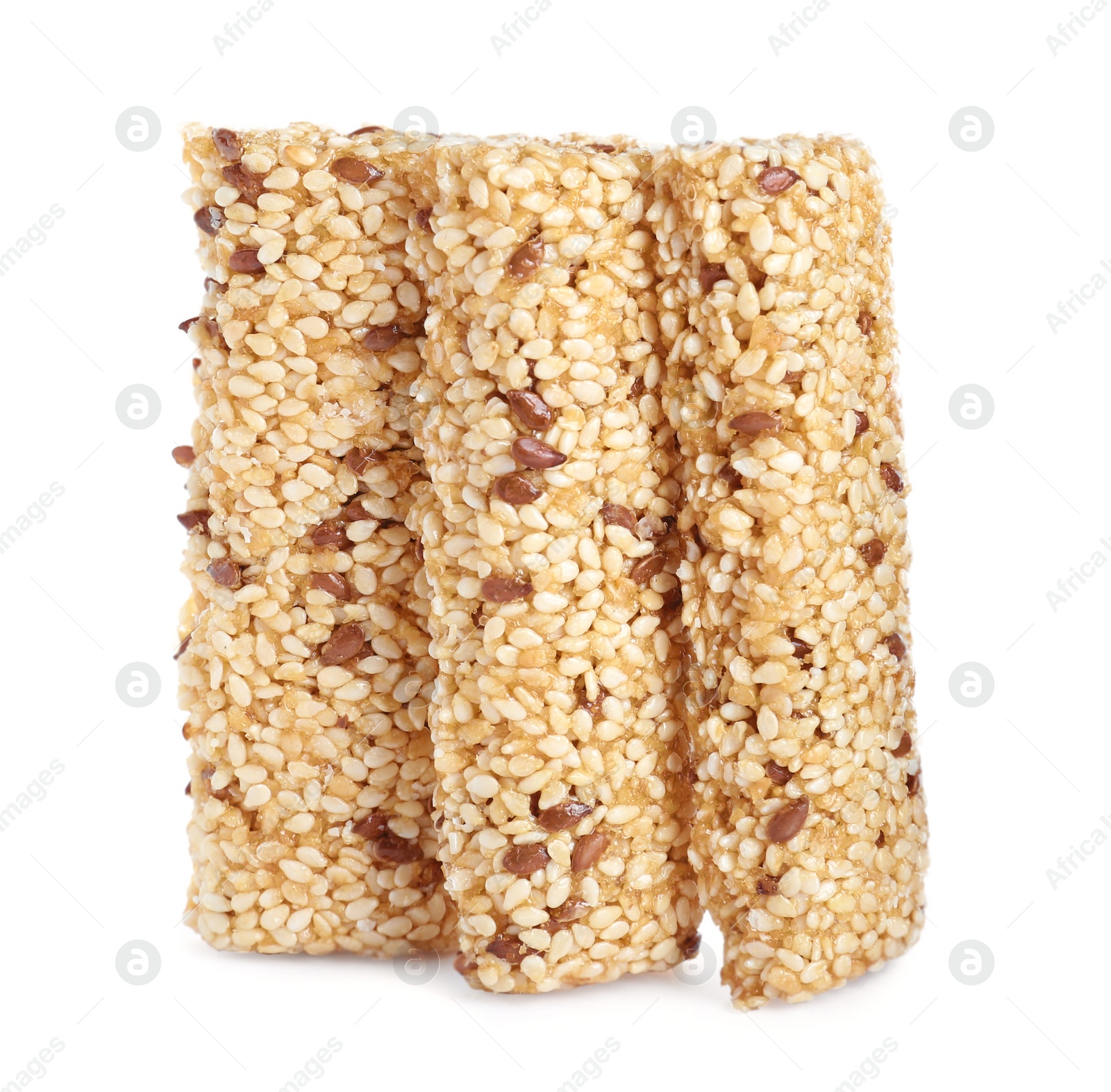 Photo of Tasty sesame seed bars isolated on white