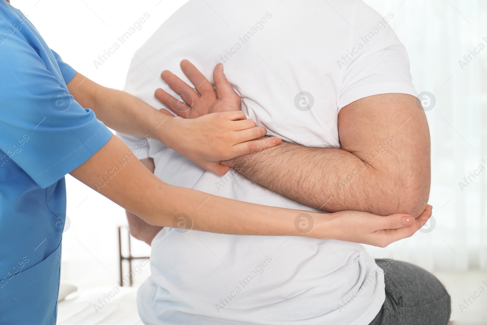 Photo of Doctor working with patient in hospital, closeup. Rehabilitation physiotherapy