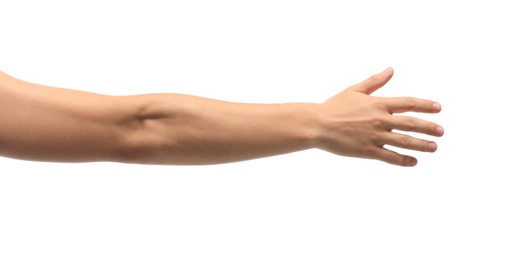 Photo of Young man held out hand on white background, closeup