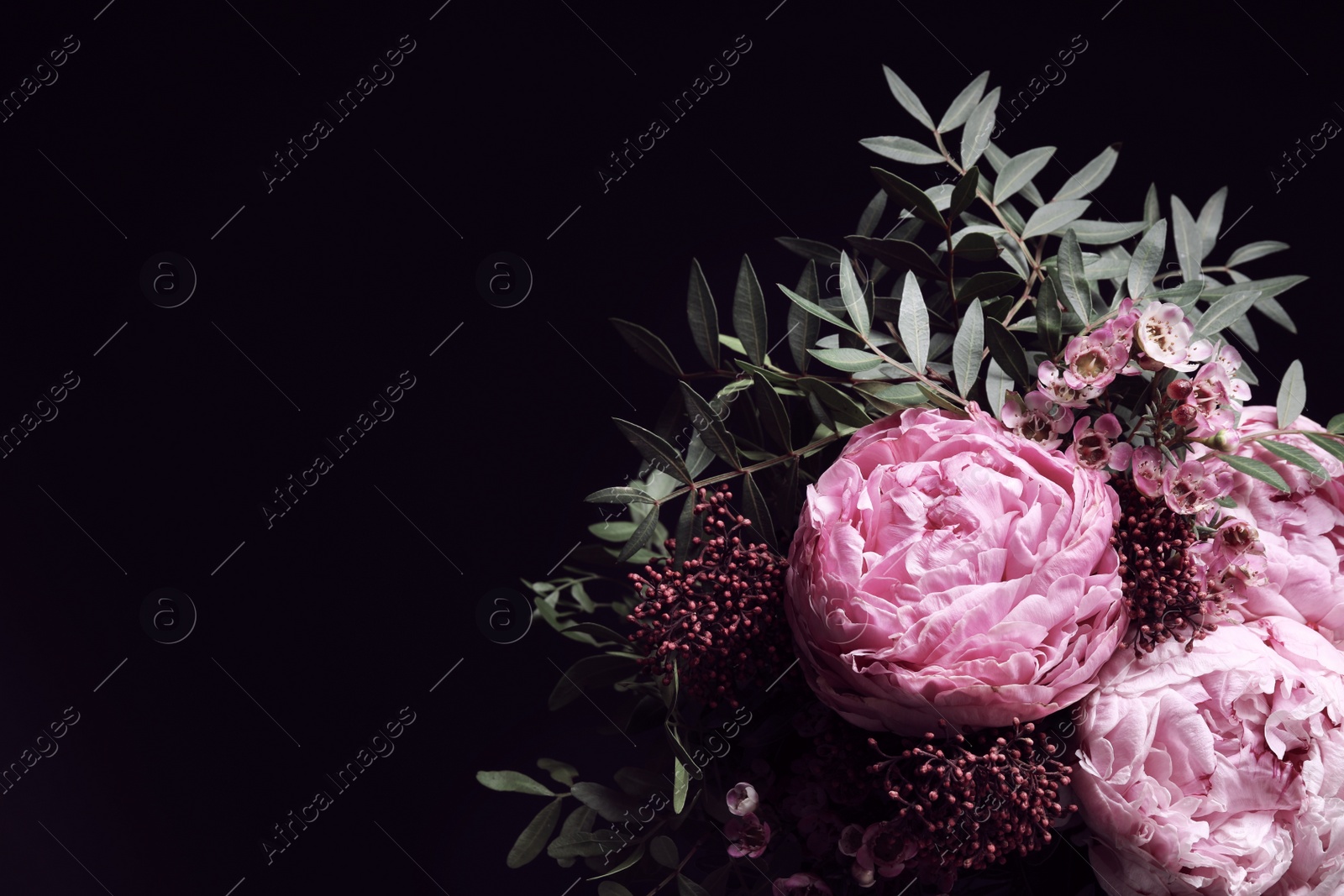 Photo of Bouquet of beautiful flowers on black background, space for text. Floral card design with dark vintage effect