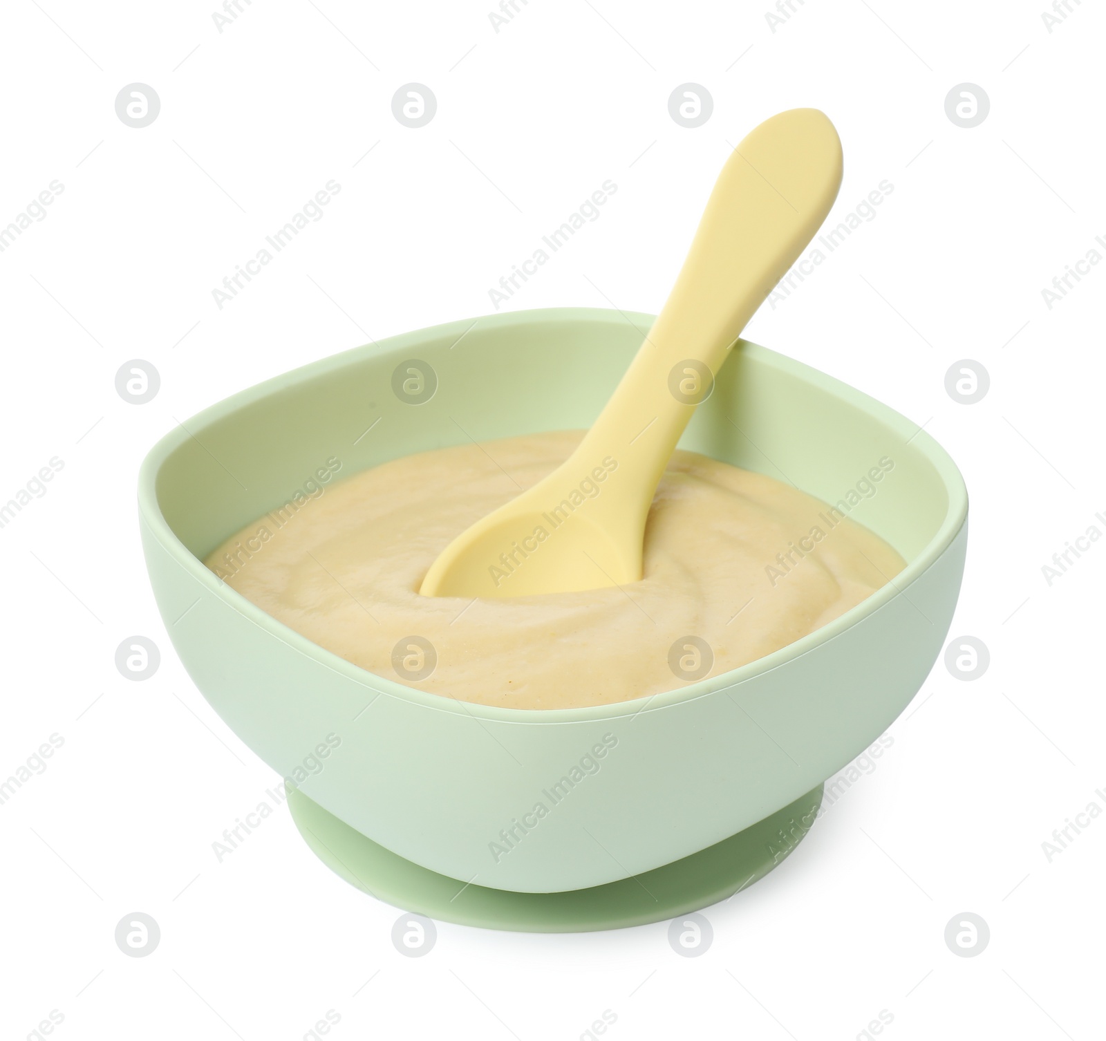 Photo of Tasty baby food and spoon in bowl isolated on white