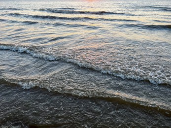 Beautiful view of sea waves at sunset