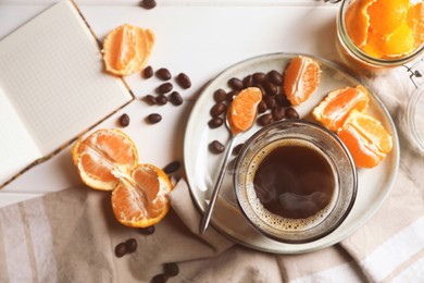 Photo of Flat lay composition with many fresh ripe tangerines and book on white wooden table