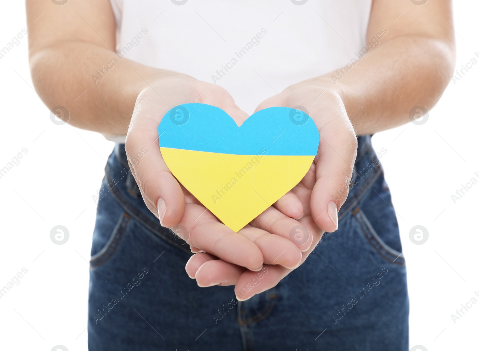 Photo of Woman holding paper heart in colors of Ukrainian flag on white background, closeup