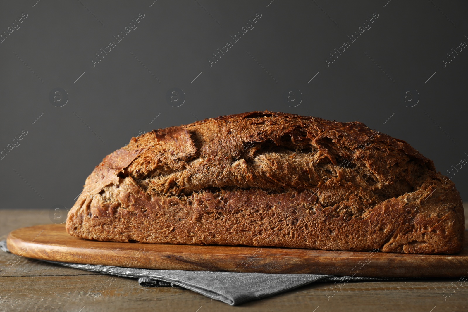 Photo of Freshly baked sourdough bread on wooden table