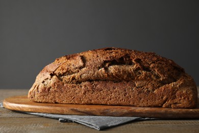 Photo of Freshly baked sourdough bread on wooden table