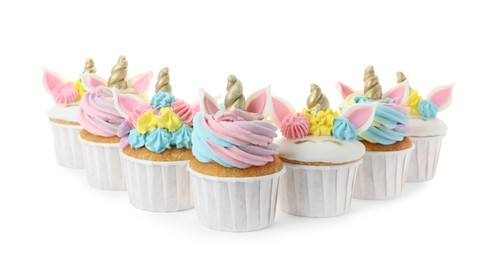 Many cute sweet unicorn cupcakes on white background