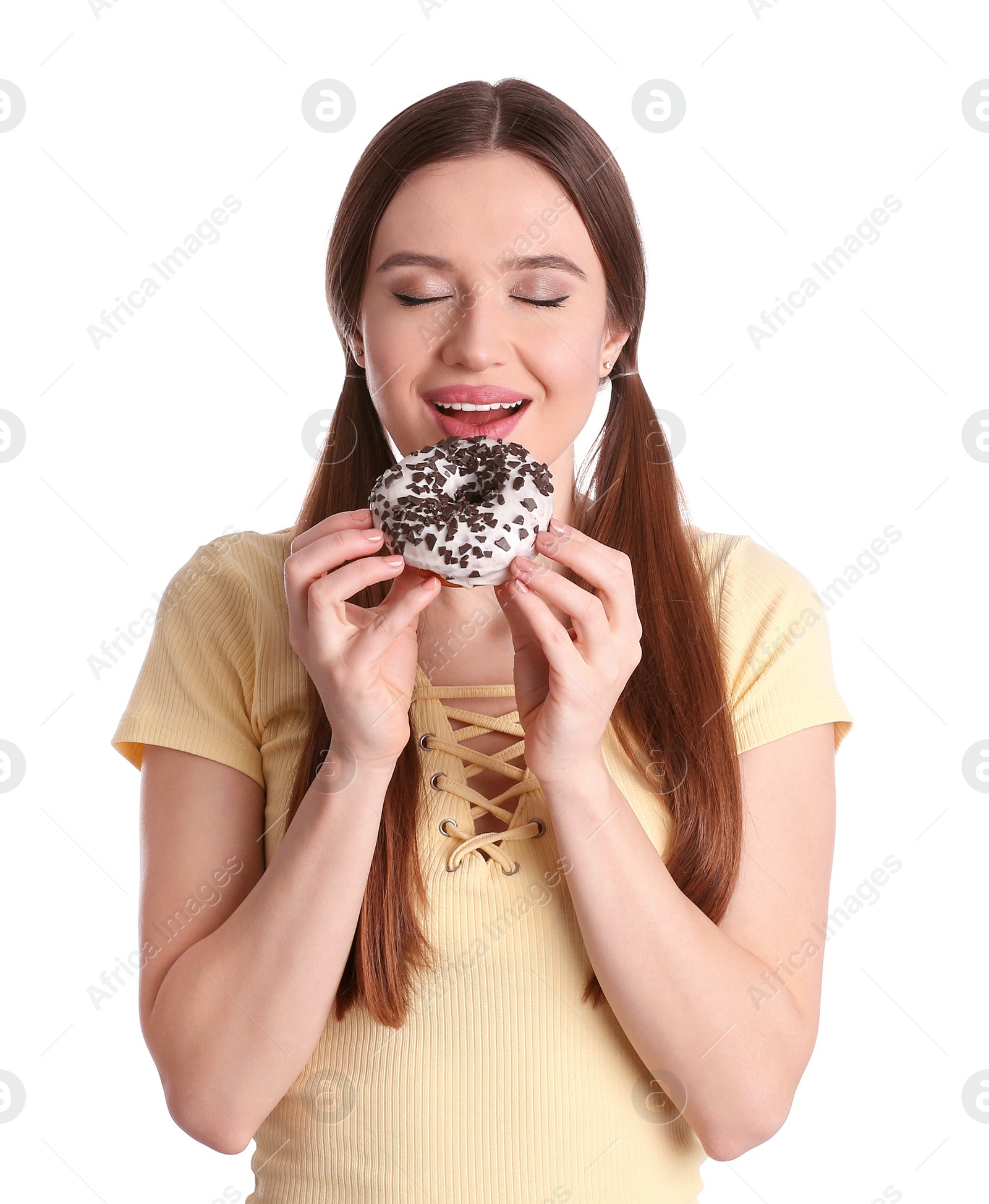 Photo of Beautiful young woman with donut on white background