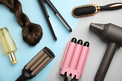 Flat lay composition with hairdressing equipment on color background