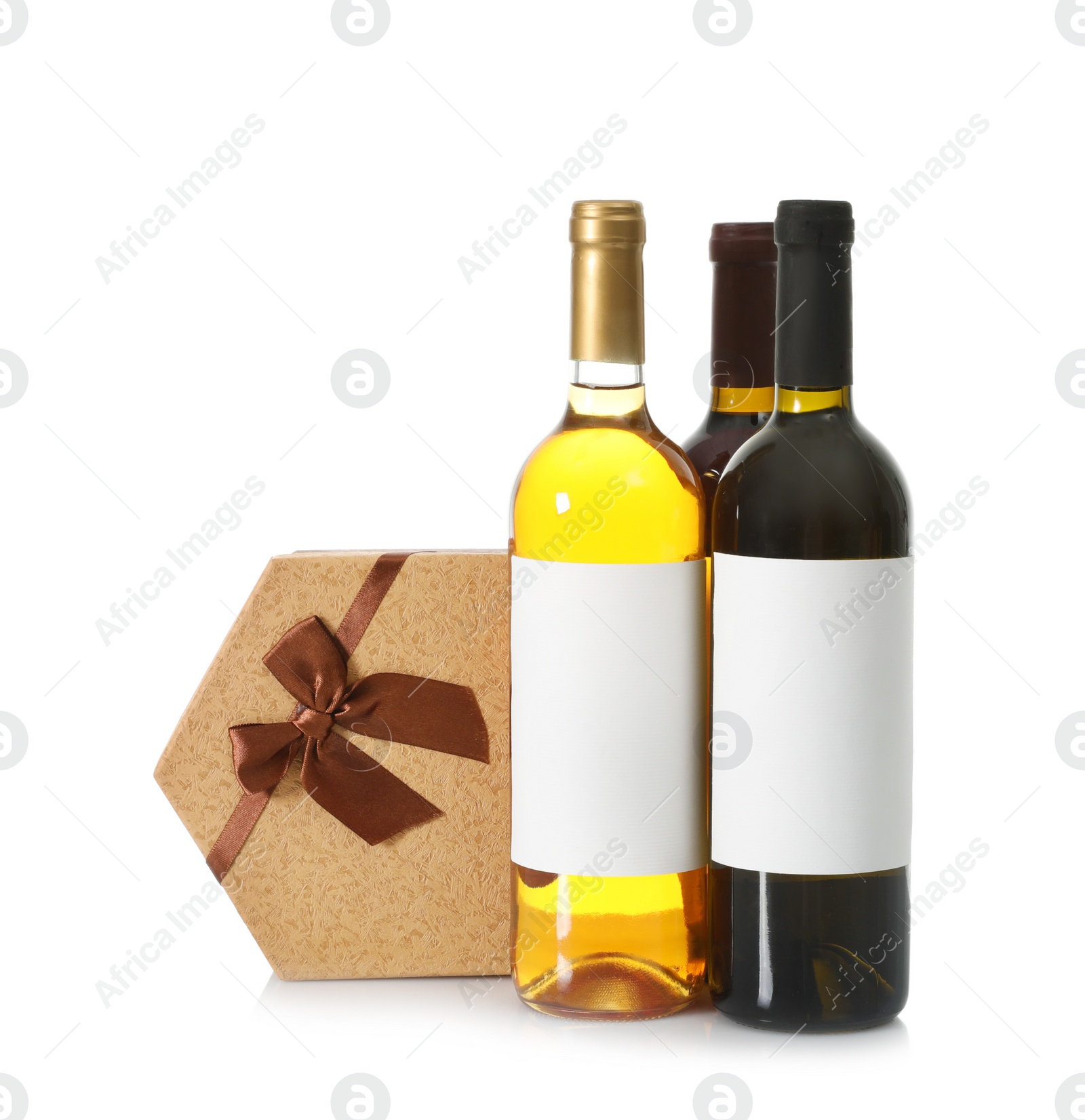 Photo of Bottles of wine and gift box on white background