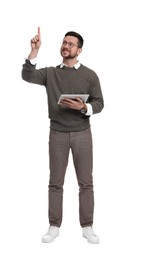 Handsome bearded businessman in eyeglasses with tablet pointing at something on white background