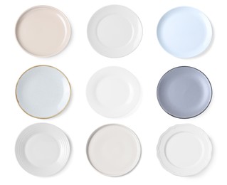 Set of different ceramic plates on white background, top view