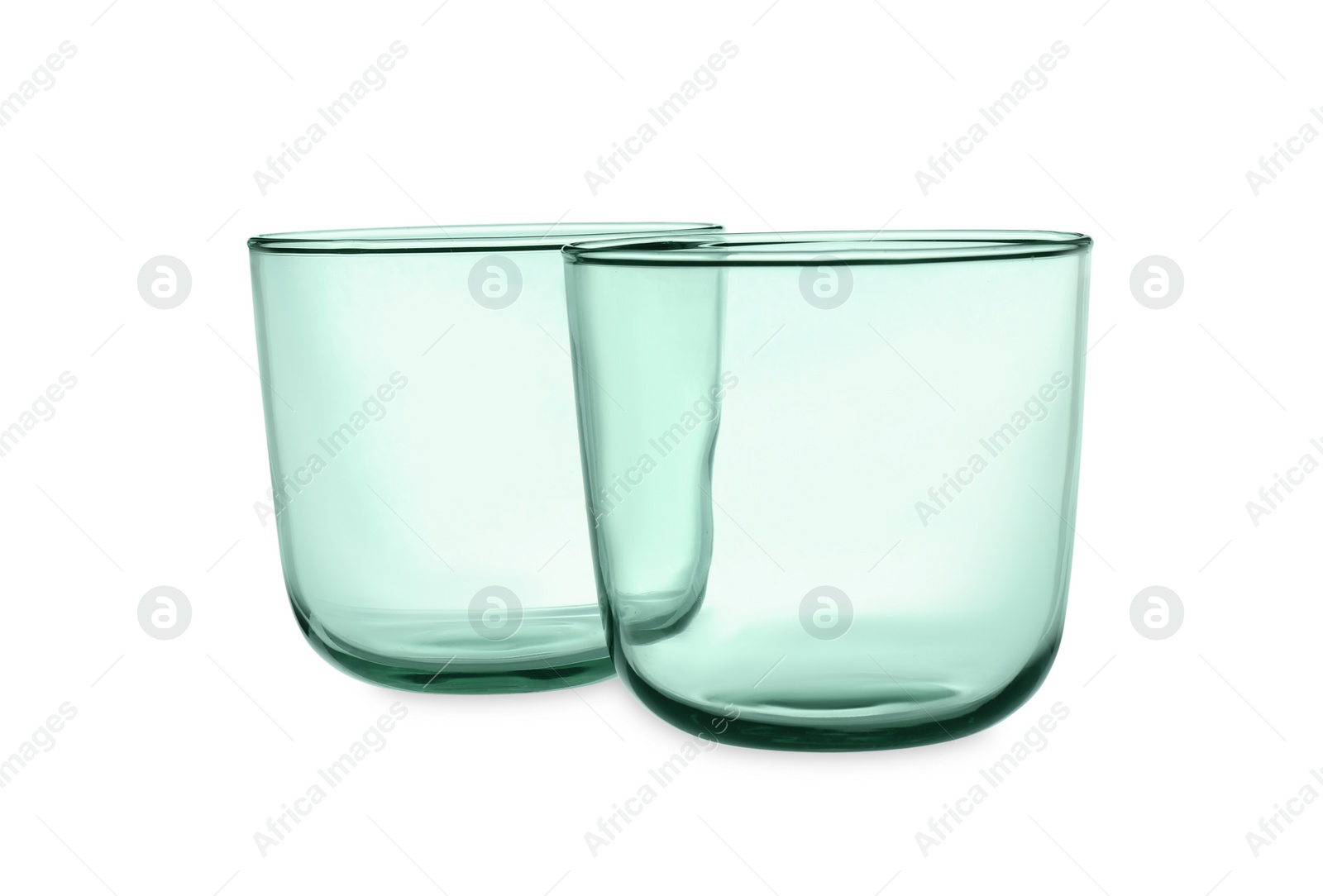 Photo of Elegant clean empty glasses on white background