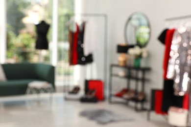 Photo of Blurred view of modern dressing room interior with stylish furniture