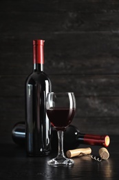 Composition with delicious red wine on wooden table