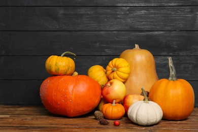 Happy Thanksgiving day. Beautiful composition with pumpkins on wooden table