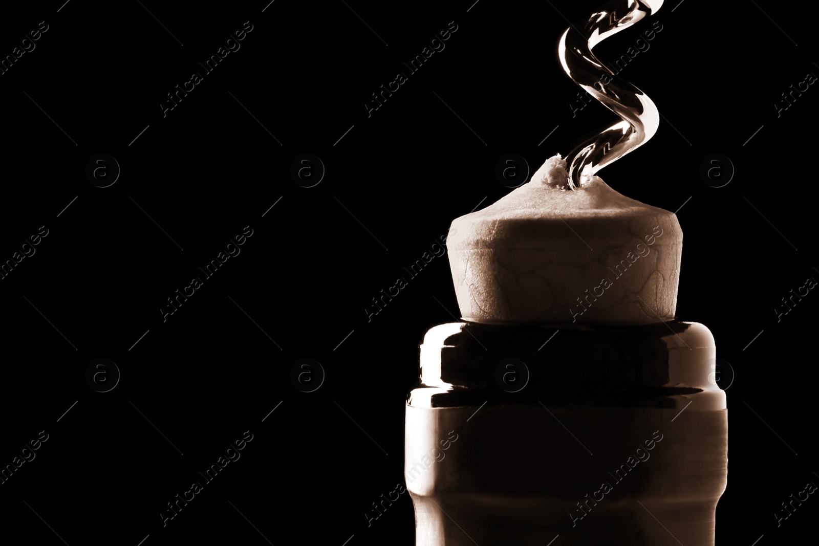 Image of Opening wine bottle with corkscrew on dark background, closeup. Space for text