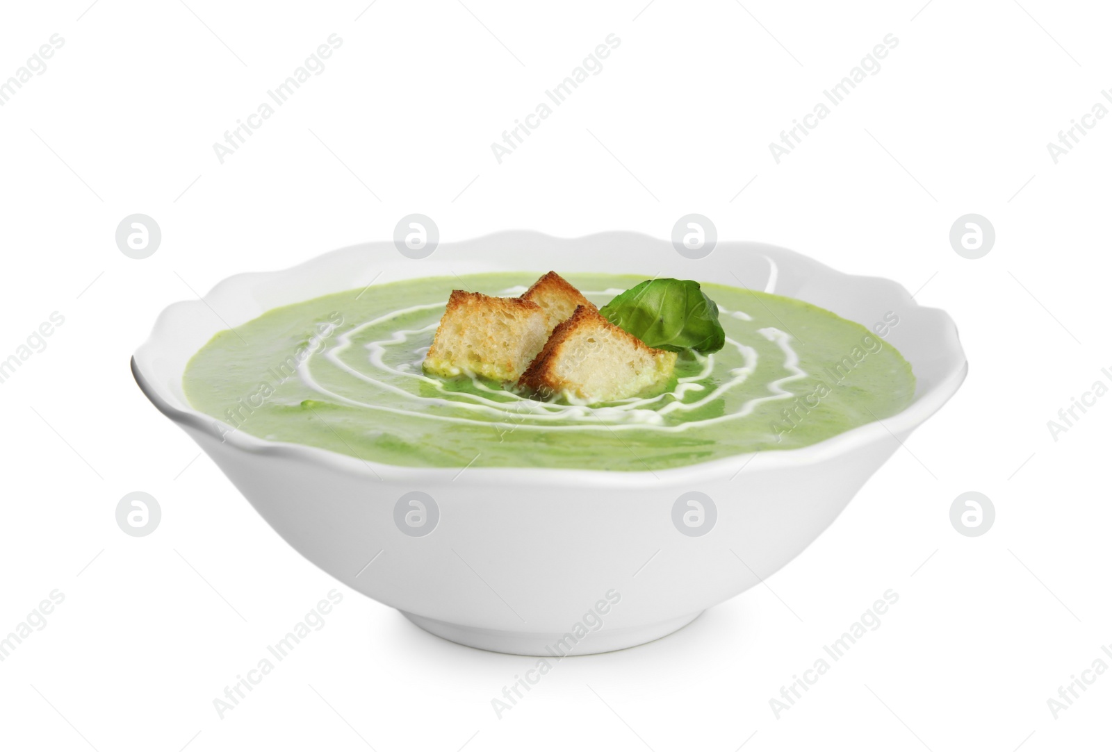 Photo of Delicious broccoli cream soup with croutons isolated on white