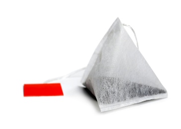 Photo of Tea bag on white background. Aromatic drink