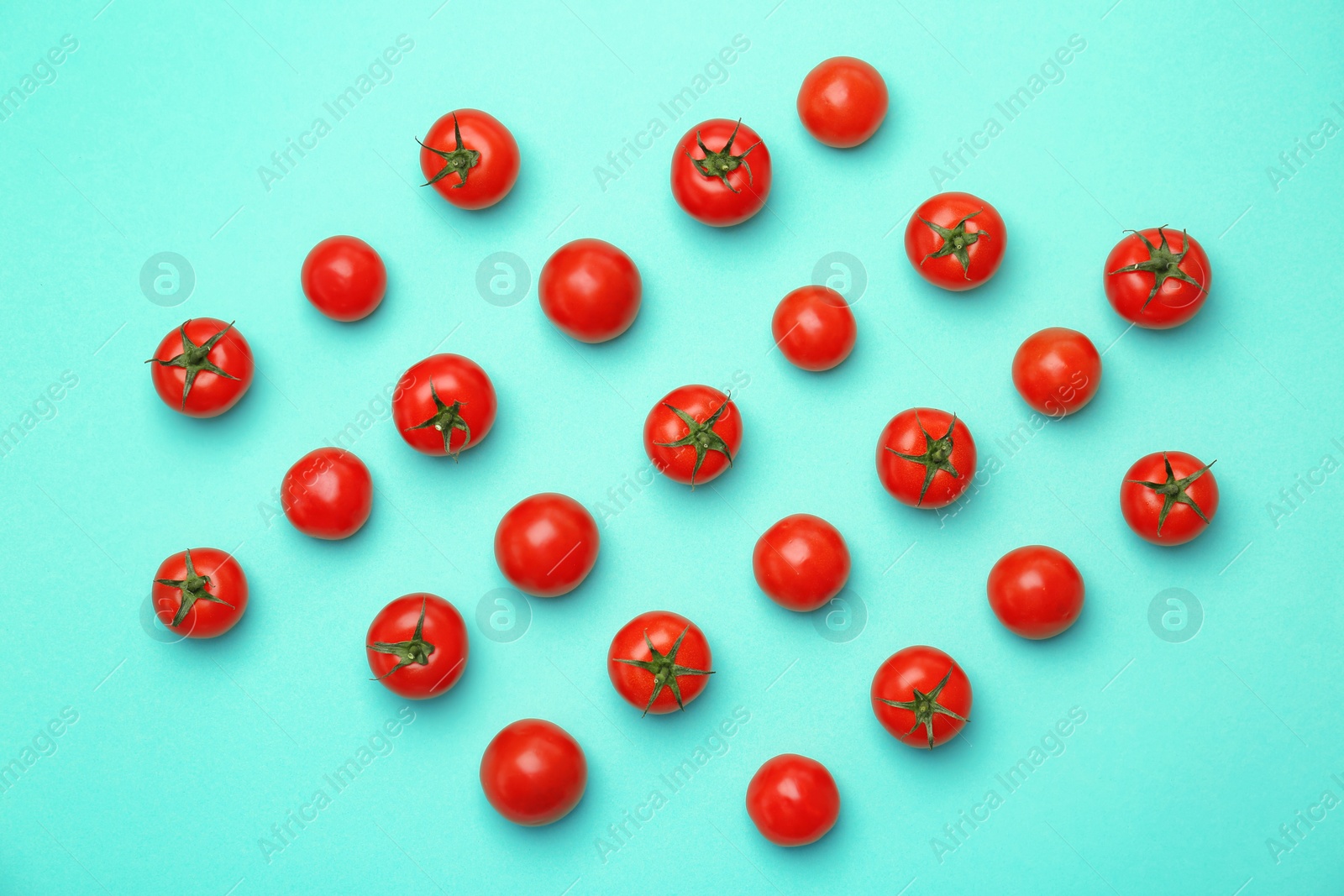 Photo of Flat lay composition with ripe tomatoes on color background