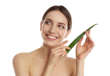 Photo of Happy young woman with aloe leaf on white background