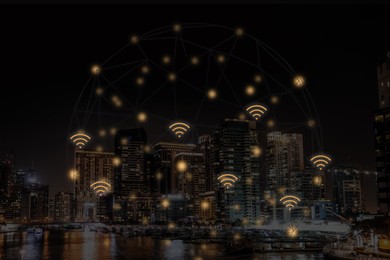 Image of Picturesque view of city with buildings at night and wi-fi symbols