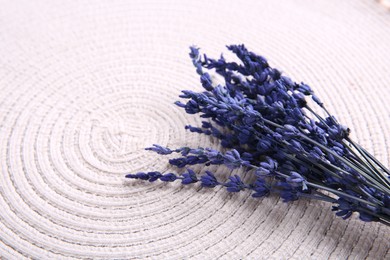 Photo of Bouquet of beautiful preserved lavender flowers on white cotton place mat, space for text