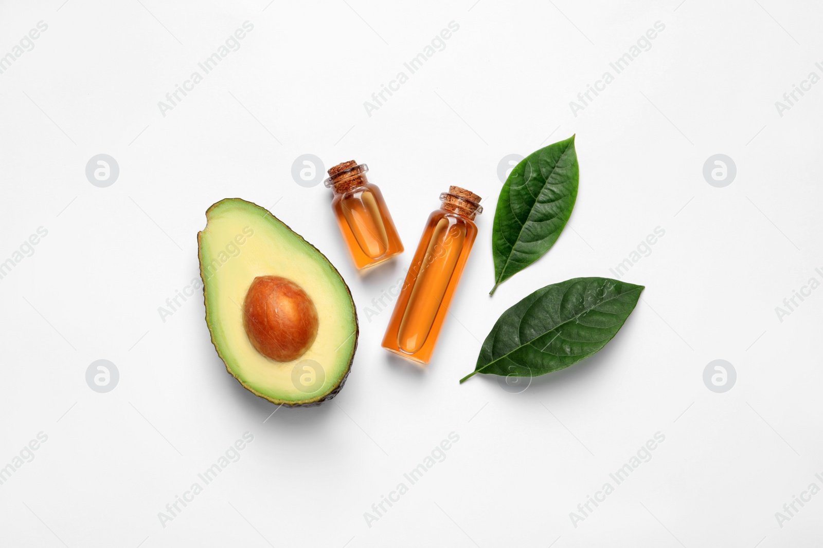 Photo of Flat lay composition with essential oil and avocado on white background