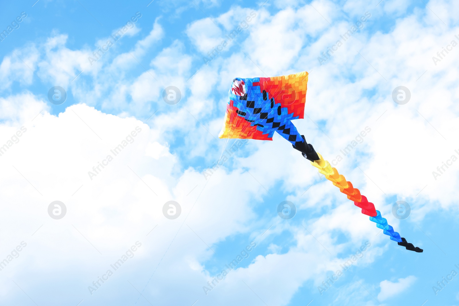 Photo of Beautiful kite drifting in blue sky