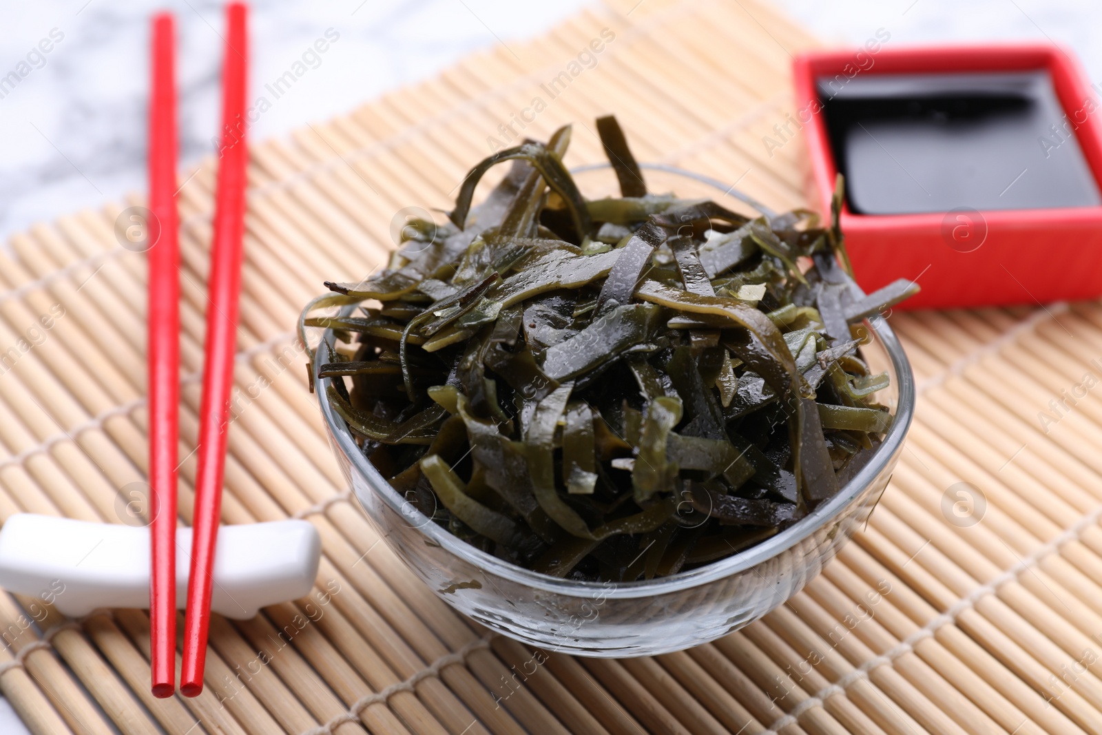 Photo of Fresh laminaria (kelp) seaweed served on table