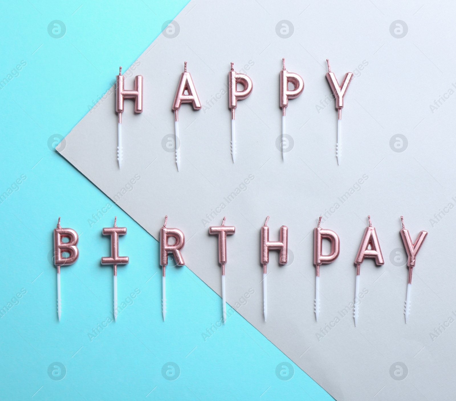 Photo of Flat lay composition with birthday candles on color background